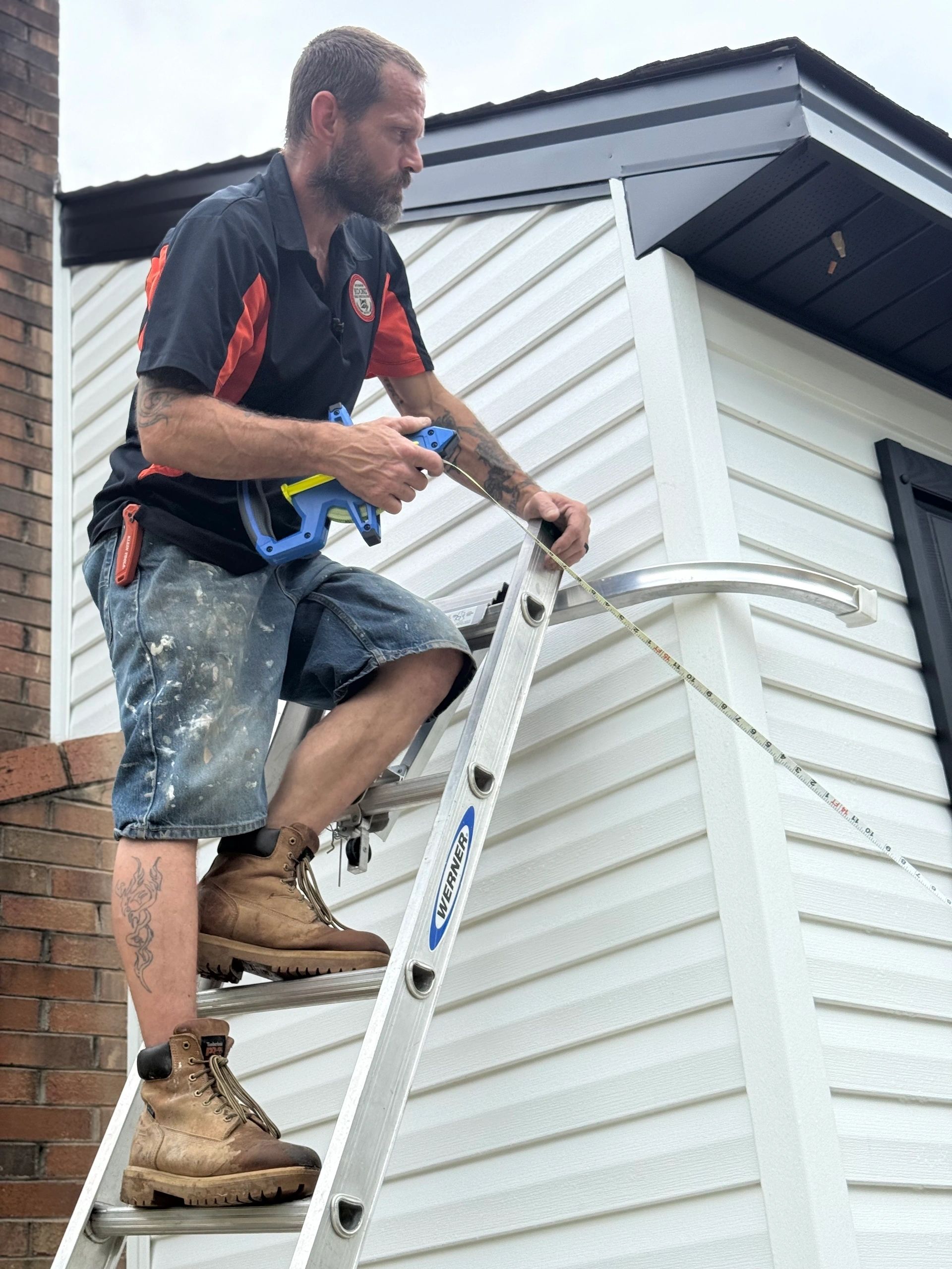 Up the ladder fitting gutter to the fascia.