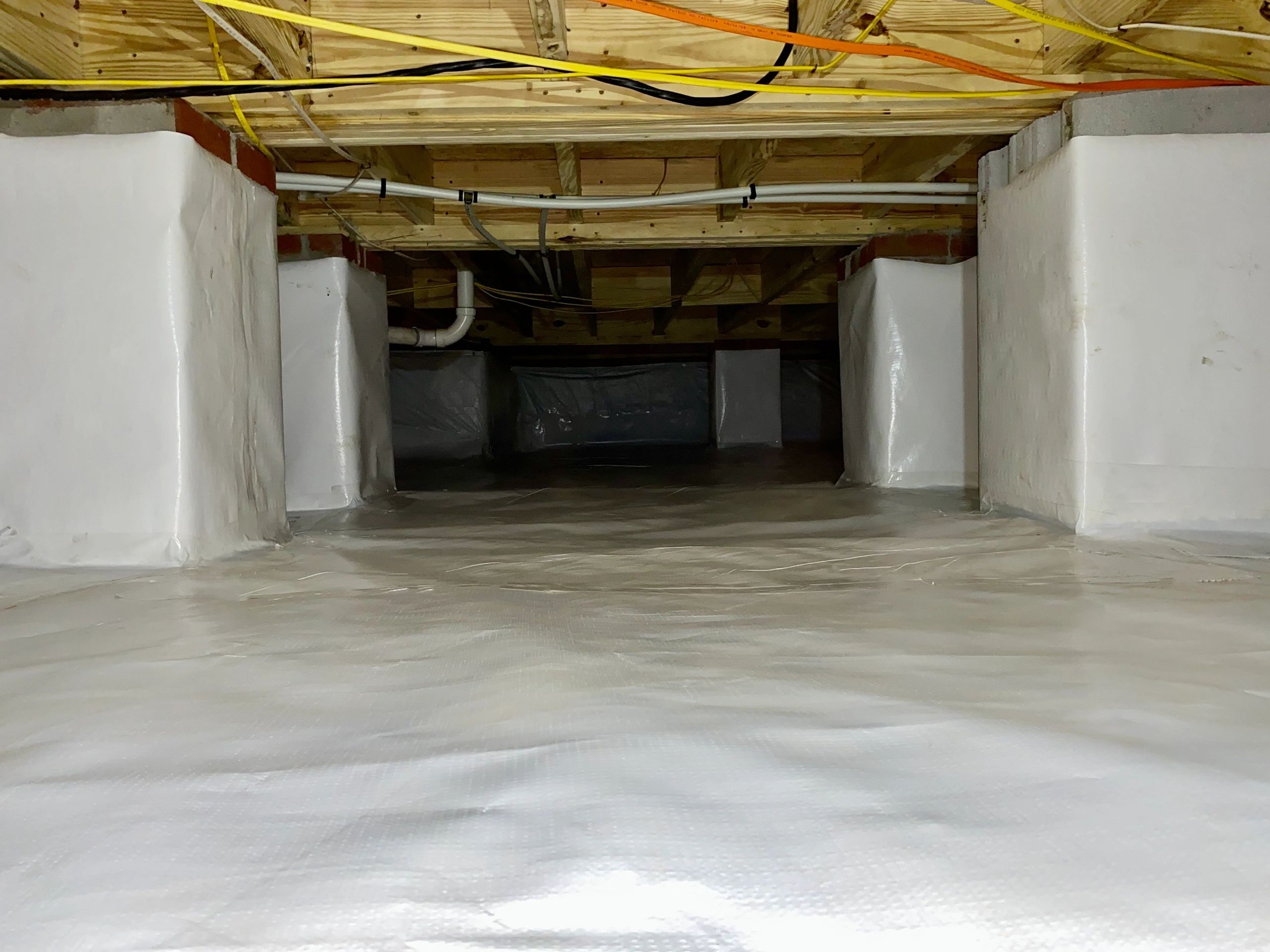 The same kind of finished space, wall to wall in white liner, lit clean.