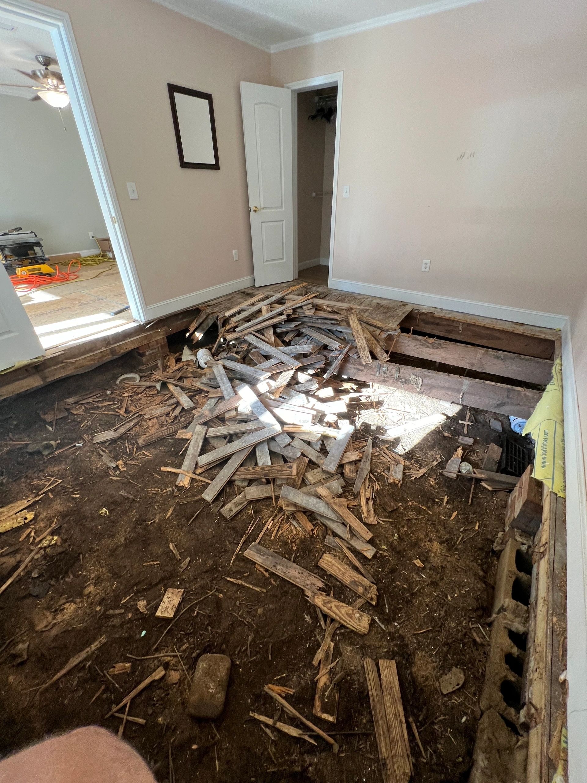 The old floor out and stacked, ready to go.