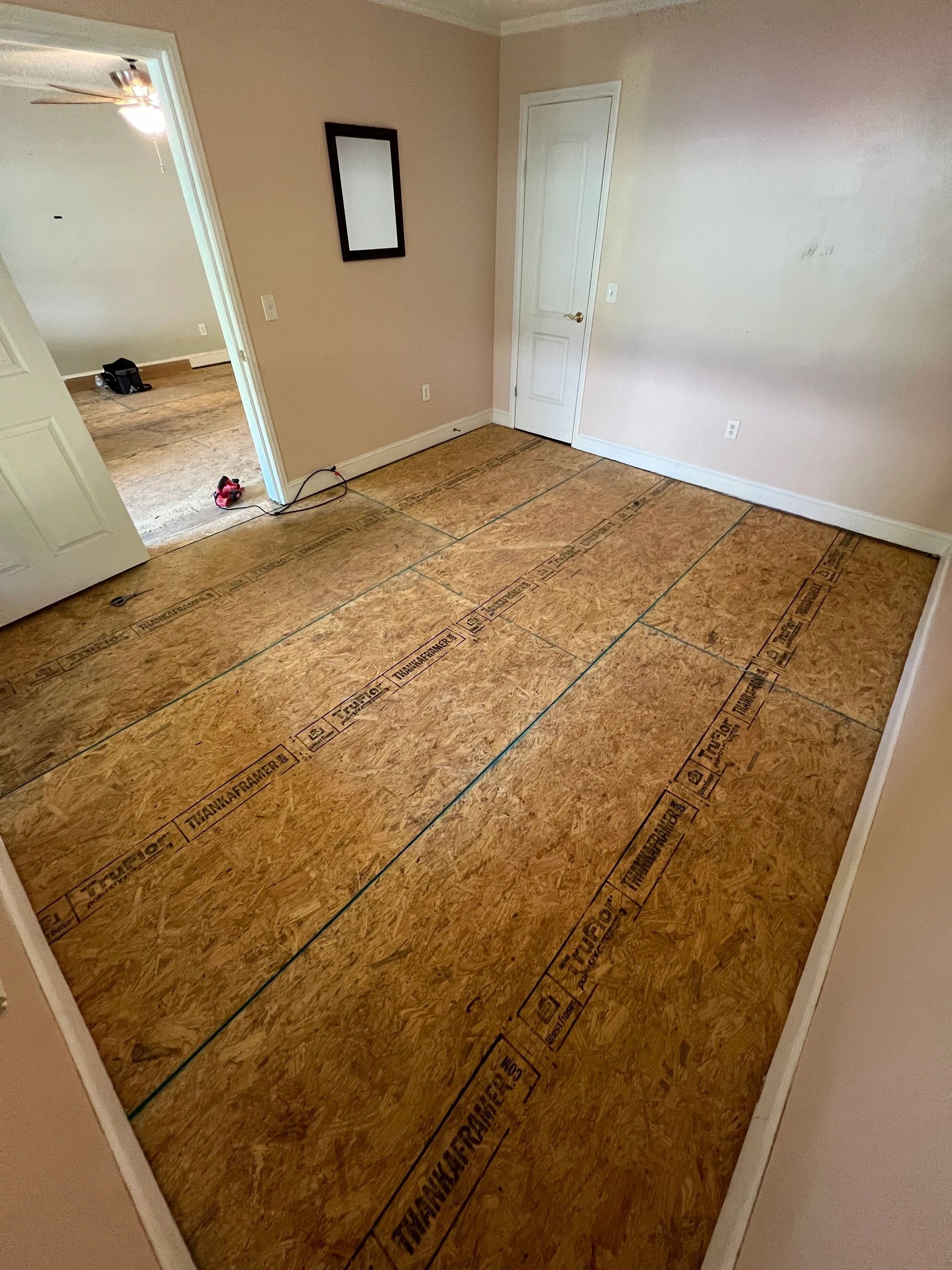 The finished deck, swept and square, waiting on floor covering.