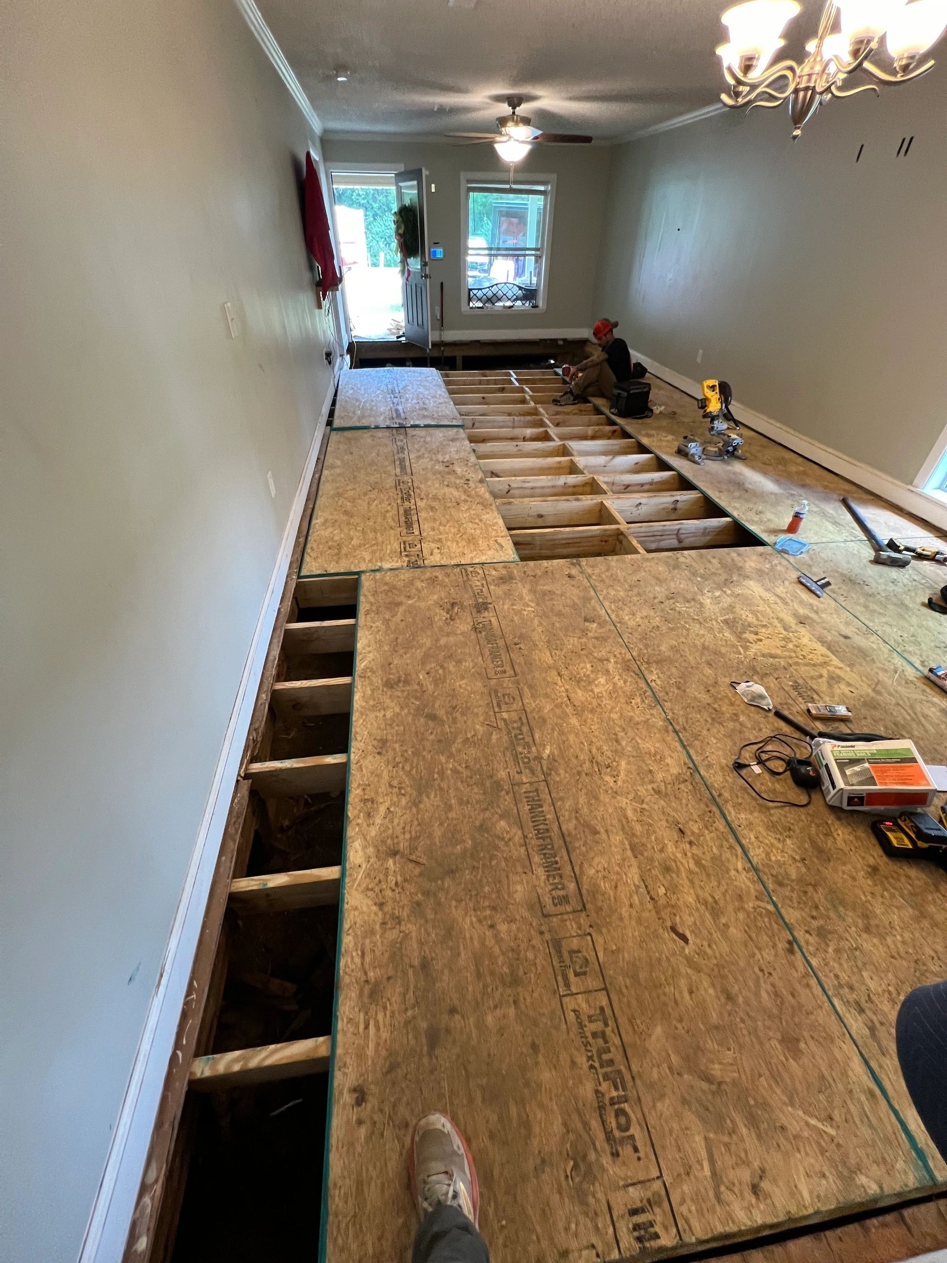 New subfloor going down over fresh joists.