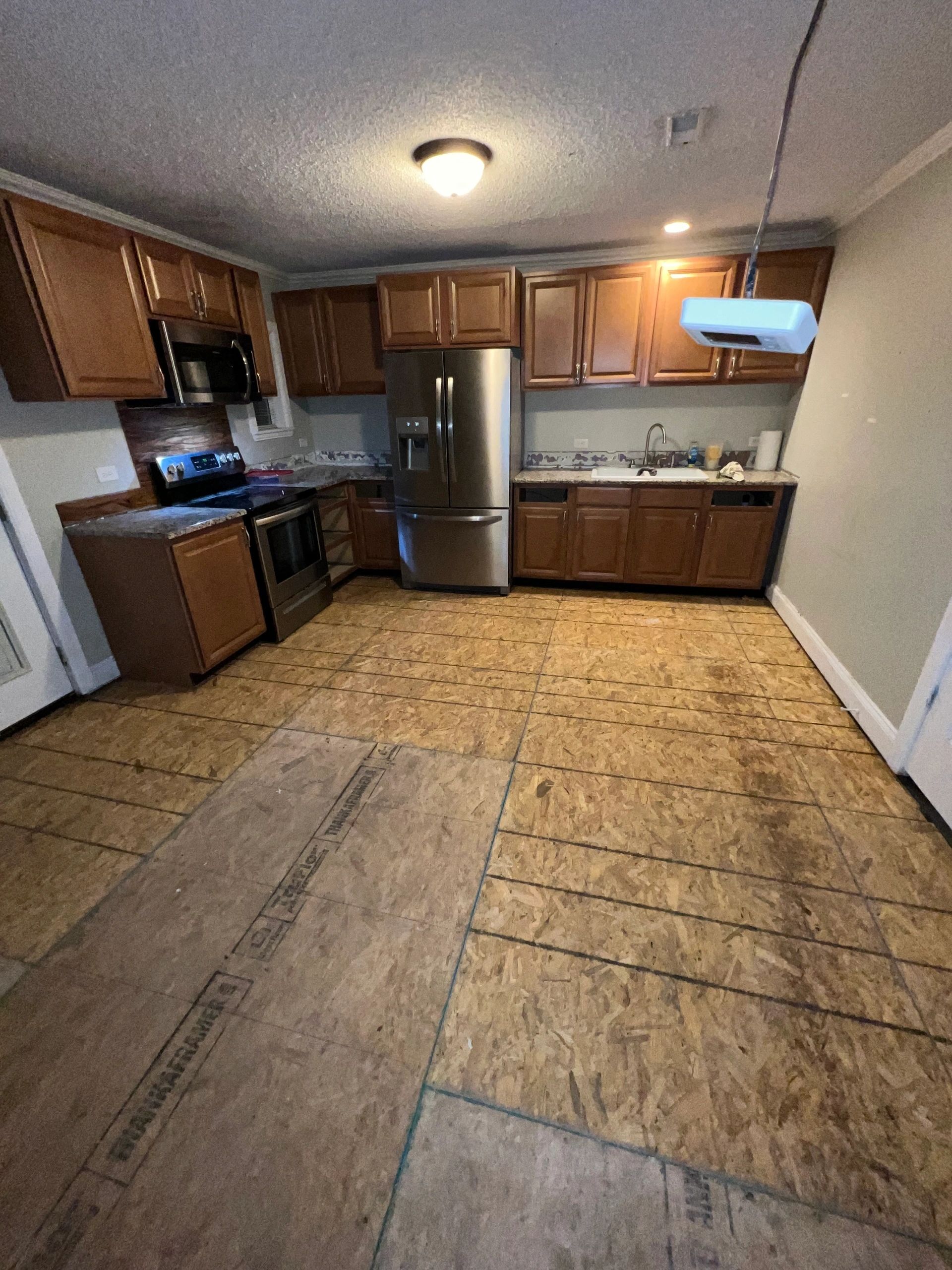 New subfloor run right through a kitchen.