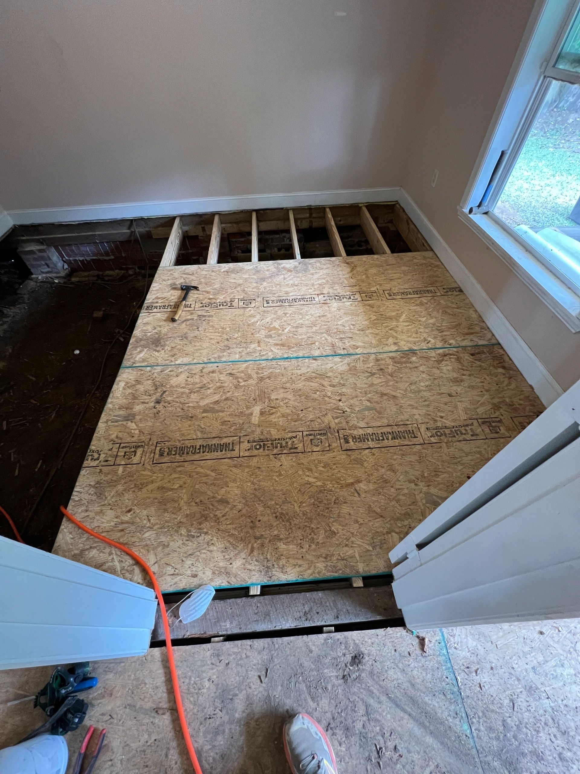 A section of subfloor replaced back into the existing run.