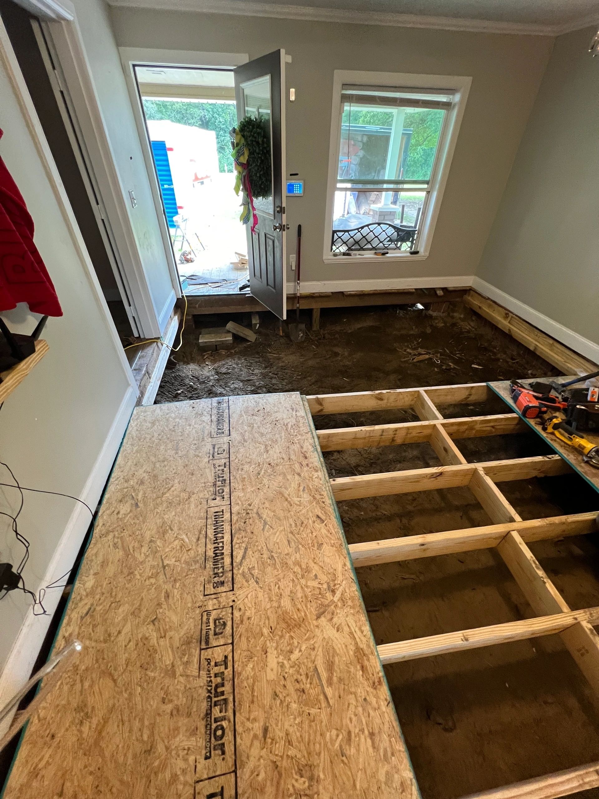Subfloor sheets laid out and cut to the room.